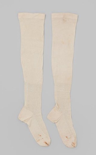 Stocking of white cotton tricot with knitted openwork stripes from the calf to the instep
