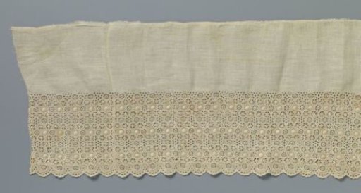 Strip of linen with openwork circles with suns and stars