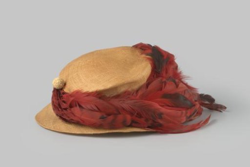 Hat of fine natural straw with feather trim