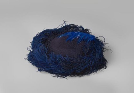 Toque of blue felt with a blue ostrich feather