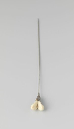 Hatpin with an iron pin and crown-shaped knob containing two pieces of white bone