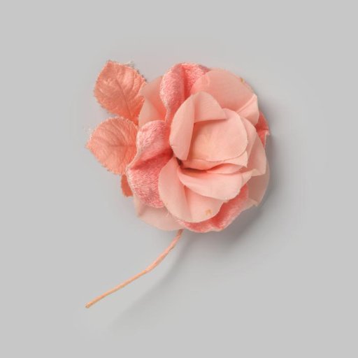 Corsage in the shape of a pink rose