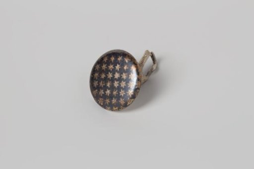 Round Cufflink of Nielloed Silver with a Star Pattern