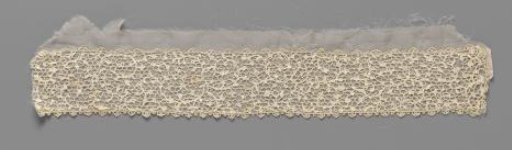 Strip of needle lace with floral motifs