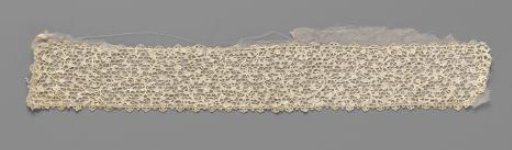 Strip of needle lace with floral motifs