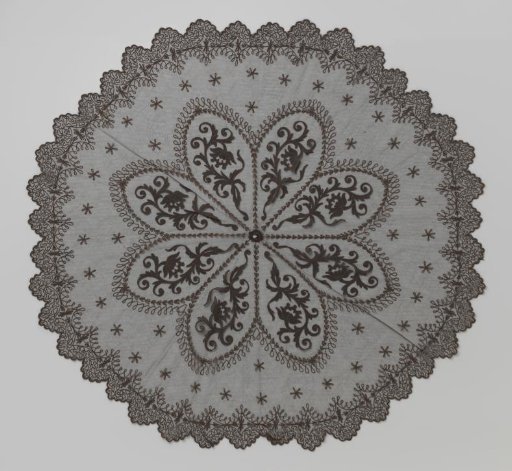 Parasol deck of black tulle decorated with an appliqué of a large eight-pointed star and with tambour work