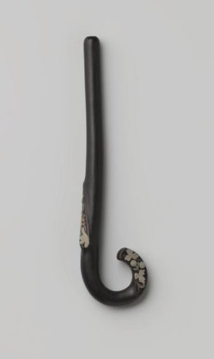 Handle for an umbrella or parasol of black plastic with silver-colored inlay