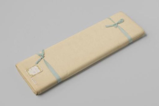 Strip of white silk gauze with two light blue ribbon bows around it