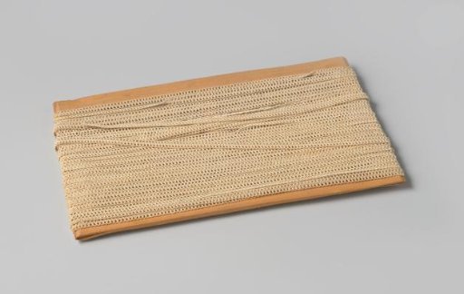 Passement of Shining Cream-Colored Cord with Loops Woven Through, on a Wooden Frame