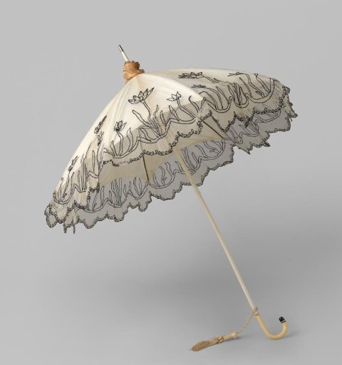 Parasol with canopy of white tulle with black embroidery of three flowers, on a white-painted wooden stick, with a curved, ivory-coloured handle