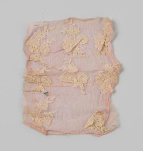 Strip of rose fabric with white applied lace, very roughly attached
