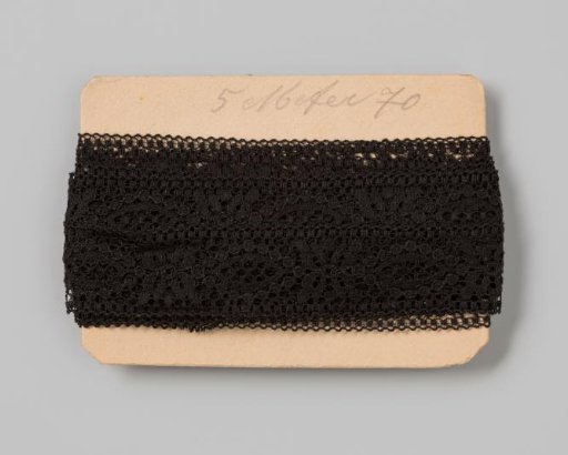 Cardboard with black entre-deux and galloon