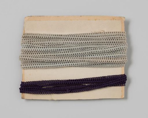 Braid of shiny dark blue cord with loops woven through