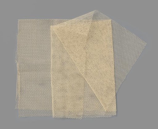 Measuring of cream-white coarse cotton tulle