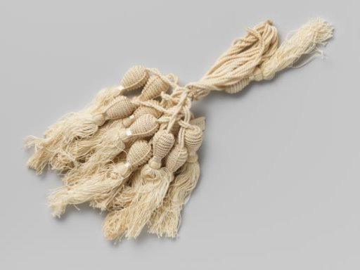 Thirteen cords of beige silk with tassels hanging from them