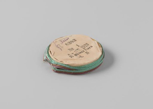Ribbon on a roll, striped, green with magenta, black, gray, and orange