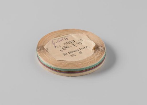 Ribbon on a roll, striped, green with magenta, black, gray, and orange