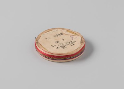 Ribbon on a roll, striped, red with beige, black, lilac and orange