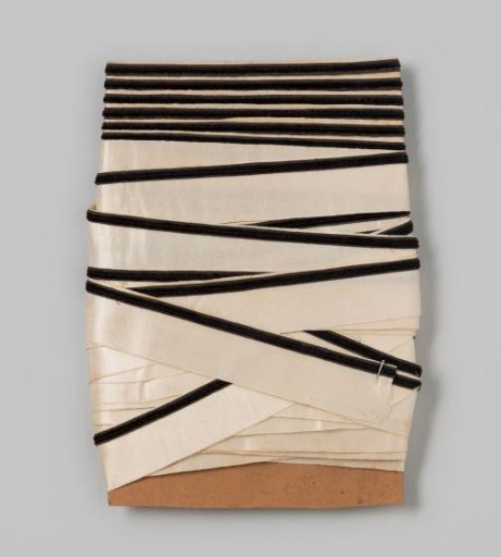 Ribbon on cardboard, white satin ribbon with a narrow black velvet ribbon on it
