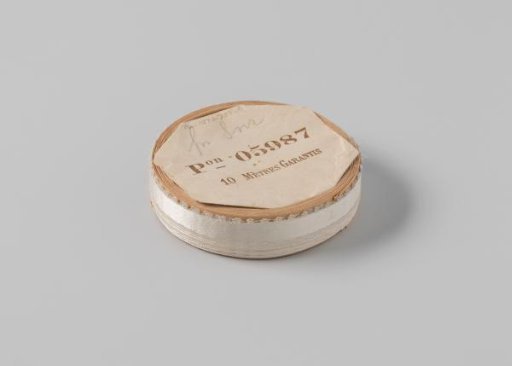Ribbon on a roll, white satin with one side featuring picots