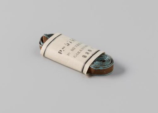 Ribbon in paper band, brown with blue edging on both sides