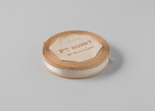 Ribbon on a roll, white satin with one side featuring picots
