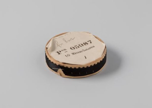 Ribbon on a roll, black satin with one side featuring picots