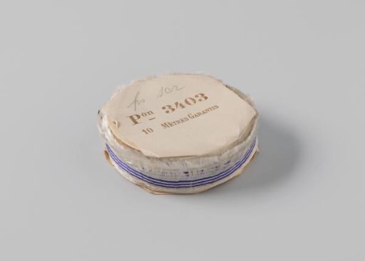 Roll with white ribbon with one frayed side and three blue horizontal stripes