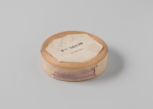 Roll with lilac satin ribbon with one frayed side