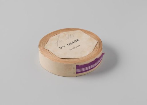 Roll with a purple ribbon with one frayed side and three white horizontal stripes