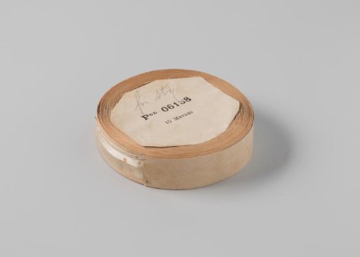 Roll with white satin ribbon with one frayed side