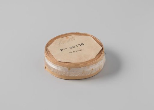 Roll with white satin ribbon with one frayed side