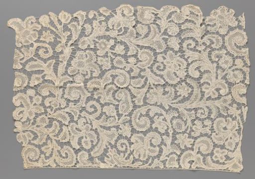 Albany strip (part) of bobbin lace with feathered leaves and palmette flowers
