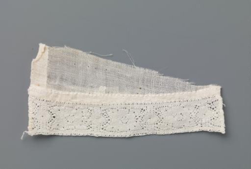 Strip of Bobbin Lace with Stylised Flower between Two Vertical Lines and Ovals on a Triangular Fragment of Linen Batiste