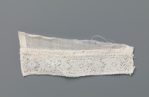 Strip of Bobbin Lace with Stylised Flower between Two Vertical Lines and Ovals on a Triangular Fragment of Linen Batiste