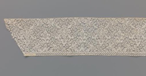 Strip of bobbin lace with two candelabrum motifs