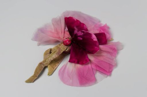 Corsage of roses of pink velvet and silk and gauze with green velvet stem