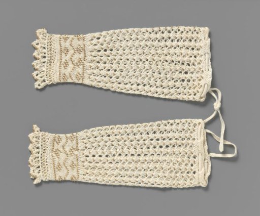 Mitten of white knitted cotton in openwork pattern decorated with beads