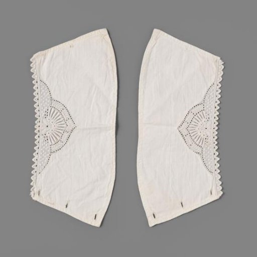 Cuff of batiste decorated with white work in the form of rosettes, feathers, and flowers