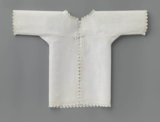 Shirt with short sleeves of white fine linen, trimmed along the front panels, neckline and sleeves with carved lace and further with narrow openwork borders