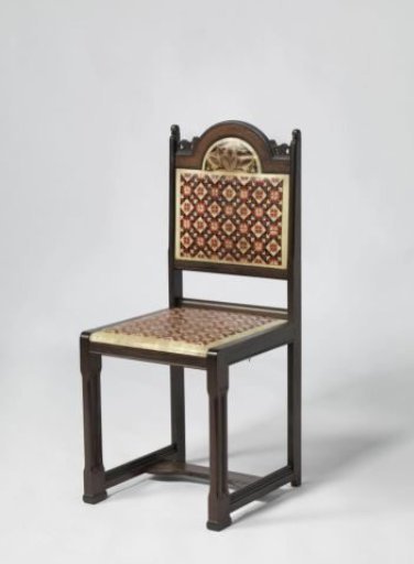 Chair covered with red, white, and black checkered batik parchment