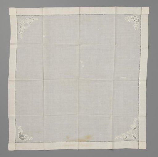 Handkerchief of linen batiste, decorated in the corners with plumetis embroidery