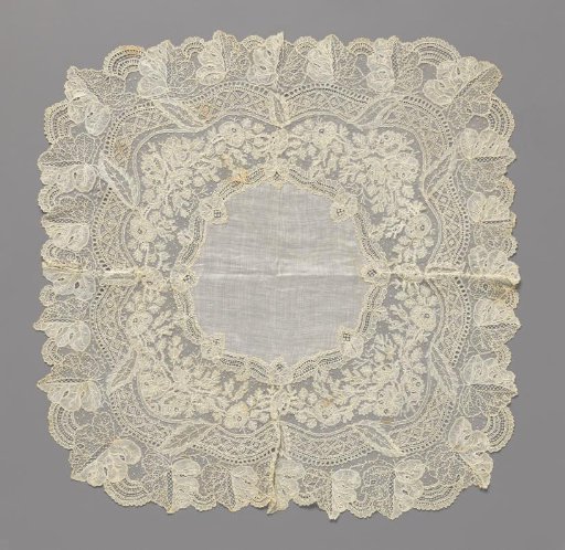 Handkerchief of Batiste with Border of Mixed Lace, Wavy Ornamental Border with Diamonds around Rose Branches, and Outer Border of Vine Leaves