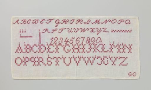 Mending patch of linen with a grid of red letters and numbers, marked: GG