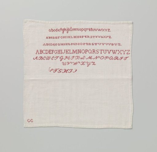 Linen sampler with a grid of red letters, marked: GG