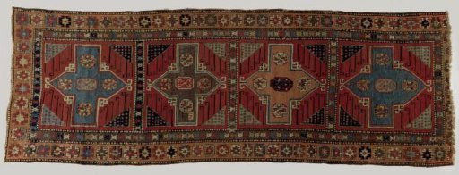Carpet decorated with four linked squares containing cross medallions filled with octagons