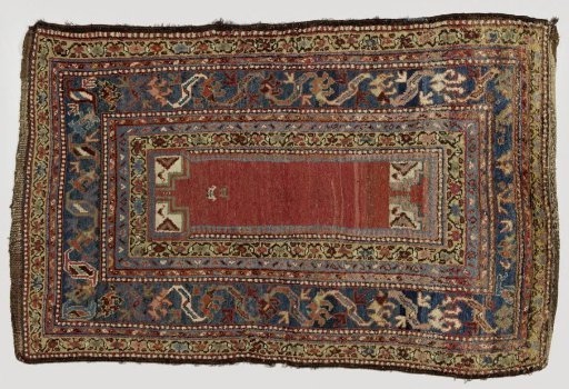 Prayer carpet with mihrab featuring a three-stepped gable and white loops