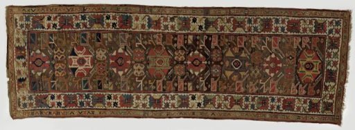 Floral carpet with stylized floral scrolls on a dark brown ground with a white border with so-called crab ornament