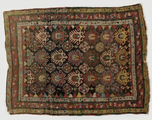 Palmette carpet with a repeating pattern of stylized lotus flowers and volute rosettes and triangles; border with floral motifs