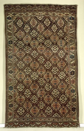 Oriental carpet with lattice work and flowers